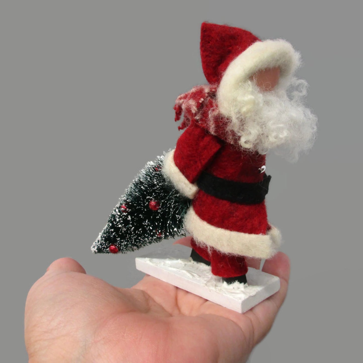 Santa Dragging a Christmas Tree