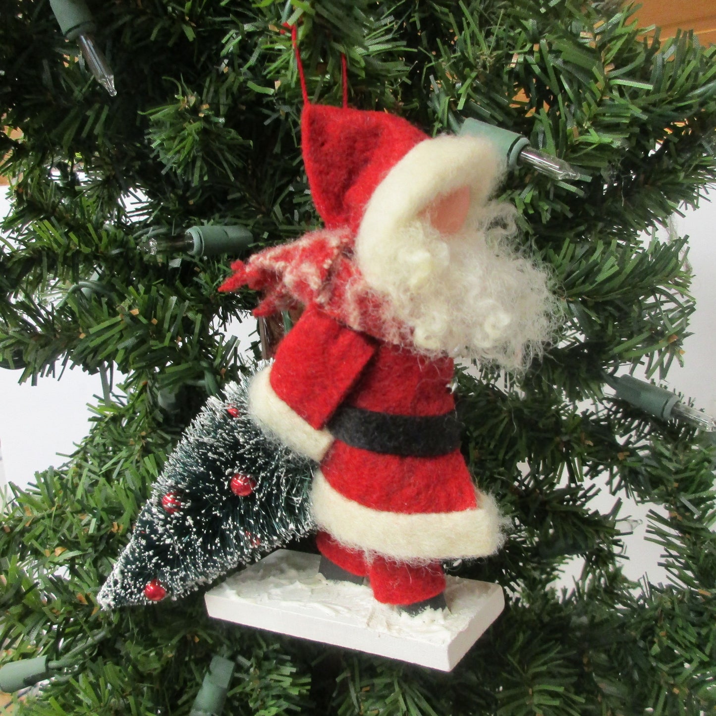 Santa Dragging a Christmas Tree