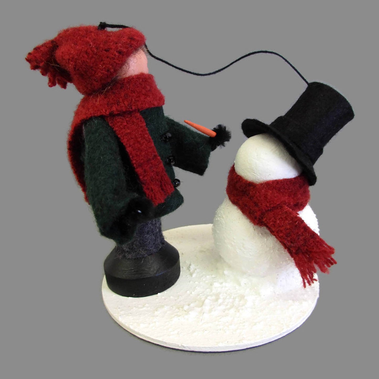 Boy Making A Snowman